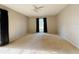 Spacious bedroom featuring neutral walls, carpet floors and a ceiling fan above the window at 1120 Arden St, Longwood, FL 32750