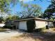 Charming home showcasing a well-manicured lawn, a two-car garage, and tasteful landscaping at 1120 Arden St, Longwood, FL 32750
