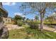 Serene backyard with lush landscaping and water access for tranquil outdoor living at 119 Jana Cir, Auburndale, FL 33823