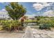 Landscaped backyard with patio space, offering a tranquil view of the canal and waterfront scenery at 119 Jana Cir, Auburndale, FL 33823