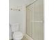 Clean, efficient bathroom featuring a toilet and a glass-enclosed standing shower for easy accessibility at 119 Jana Cir, Auburndale, FL 33823