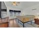 Bright bedroom with hardwood floors, natural light, and a ceiling fan offers a cozy and inviting space at 119 Jana Cir, Auburndale, FL 33823