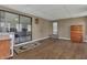 Bonus room featuring a sliding glass door to the outside and hardwood floors at 119 Jana Cir, Auburndale, FL 33823
