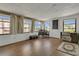 Bonus room featuring hardwood floors and many windows providing natural light at 119 Jana Cir, Auburndale, FL 33823