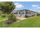 Well-kept single-story home featuring a stone-lined walkway, manicured lawn, and charming curb appeal at 119 Jana Cir, Auburndale, FL 33823