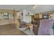 Cozy living room featuring hardwood floor and a comfortable seating arrangement under a fan at 119 Jana Cir, Auburndale, FL 33823