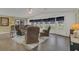 Cozy living room features hardwood floors, natural light, and comfortable seating for relaxation and entertainment at 119 Jana Cir, Auburndale, FL 33823