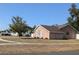Charming brick home situated on a neatly kept corner lot with mature trees at 1250 Lemonwood Ave, Deland, FL 32724