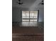 Open living space with bar-top view into the kitchen and sliding glass doors to the lanai at 1250 Lemonwood Ave, Deland, FL 32724