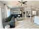 Spacious living room features vaulted ceilings and wood-look flooring, perfect for entertaining at 1311 Fallwood Dr, Deltona, FL 32725
