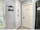 View of the pantry next to the laundry room door in the kitchen at 1311 Fallwood Dr, Deltona, FL 32725