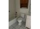 Bathroom features a tiled tub, toilet, and vanity, ready for updates at 132 Wax Myrtle Ct, Sanford, FL 32773