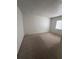 A bedroom featuring neutral walls, carpet, and a window for natural light at 132 Wax Myrtle Ct, Sanford, FL 32773