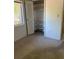 Bedroom features a closet with storage and carpet flooring at 132 Wax Myrtle Ct, Sanford, FL 32773