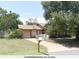 Charming single-story home with a well-manicured lawn and mature trees at 132 Wax Myrtle Ct, Sanford, FL 32773