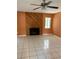 Inviting living room with a decorative fireplace, tile floor, and a ceiling fan at 132 Wax Myrtle Ct, Sanford, FL 32773