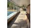 Screened in patio with tiled floors and a built-in bench at 132 Wax Myrtle Ct, Sanford, FL 32773