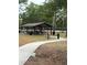 Open-air picnic shelter equipped with picnic tables and set in a park-like setting at 132 Wax Myrtle Ct, Sanford, FL 32773