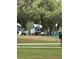 A whimsical playground area with various structures, including a small house and train car for children to enjoy at 132 Wax Myrtle Ct, Sanford, FL 32773
