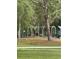 Park scene featuring swings with mature landscaping and trees at 132 Wax Myrtle Ct, Sanford, FL 32773