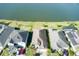 Aerial view of a well-maintained home with an expansive yard and lakeside view, showcasing privacy and curb appeal at 133 Azure Mist Way, Daytona Beach, FL 32124