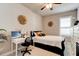 Cozy bedroom with neutral walls, decorative wall art, and a white desk for a comfortable workspace at 133 Azure Mist Way, Daytona Beach, FL 32124