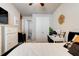Comfortable bedroom featuring neutral walls, soft white carpet, and convenient access to an ensuite bathroom at 133 Azure Mist Way, Daytona Beach, FL 32124