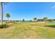 Picturesque community view by the lake, featuring lush lawns and serene water views, enhancing the neighborhood's charm at 133 Azure Mist Way, Daytona Beach, FL 32124