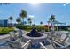 Cozy fire pit area surrounded by comfortable seating, ideal for outdoor gatherings and enjoying the evening ambiance at 133 Azure Mist Way, Daytona Beach, FL 32124