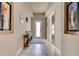 Inviting foyer with neutral tones, tile flooring, and stylish decor, creating a warm and welcoming entrance at 133 Azure Mist Way, Daytona Beach, FL 32124