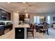 Modern kitchen featuring dark wood cabinets, a stainless steel refrigerator, and an island with pendant lighting and barstool seating at 133 Azure Mist Way, Daytona Beach, FL 32124