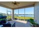Relaxing screened-in lanai offering serene lake views, perfect for outdoor dining and entertaining at 133 Azure Mist Way, Daytona Beach, FL 32124