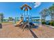 Vibrant community playground with slides and climbing structures for outdoor fun and recreation at 133 Azure Mist Way, Daytona Beach, FL 32124