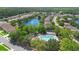 This is a birds eye view of the community, pond, and community pool at 133 Brasswood Ct, Daytona Beach, FL 32117
