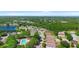 An aerial view of the community, pond, and pool at 133 Brasswood Ct, Daytona Beach, FL 32117