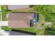 Birds eye view of the roof, screened in lanai, and landscaping at 133 Brasswood Ct, Daytona Beach, FL 32117