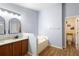 This bathroom features a garden tub, and a double vanity with granite countertops at 133 Brasswood Ct, Daytona Beach, FL 32117