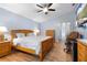 Spacious bedroom with wood floors, a comfortable bed, and natural light at 133 Brasswood Ct, Daytona Beach, FL 32117