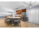 Spacious kitchen featuring a large island, stainless steel appliances, and modern lighting fixtures at 133 Brasswood Ct, Daytona Beach, FL 32117