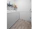 Functional laundry room with washer, dryer, and storage shelves at 133 Brasswood Ct, Daytona Beach, FL 32117