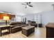 Inviting living room featuring hardwood floors, a ceiling fan, and comfortable leather furniture at 133 Brasswood Ct, Daytona Beach, FL 32117