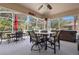 Enjoy this screened patio with tile flooring, dining, and hot tub at 133 Brasswood Ct, Daytona Beach, FL 32117
