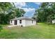 An ample backyard is a blank canvas awaiting its new owners' personal touch at 1388 15Th St, Orange City, FL 32763