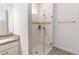 Modern bathroom featuring a glass-enclosed shower, granite countertop vanity, and sleek fixtures at 1388 15Th St, Orange City, FL 32763