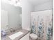 Clean bathroom featuring granite countertops, a white vanity, and a shower at 1388 15Th St, Orange City, FL 32763