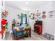 Bright, decorated bedroom with playful decor and wood-look flooring at 1388 15Th St, Orange City, FL 32763