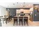 Elegant kitchen featuring a granite island with bar seating, stainless steel appliances, and a dining area at 1388 15Th St, Orange City, FL 32763