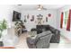 Spacious living room with modern decor, a large sectional sofa, and a decorative entertainment center at 1388 15Th St, Orange City, FL 32763