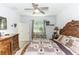 Well-lit main bedroom featuring a large bed, side tables, and a view of the window at 1388 15Th St, Orange City, FL 32763