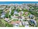 Expansive aerial view highlighting the neighborhood's proximity to the beach and well-maintained landscaping at 14 Marsh Ct, Ponce Inlet, FL 32127